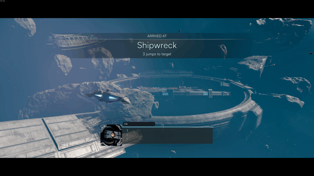 Jump Space Early Access ship approaches a derelict space station called "Shipwreck" in a debris-filled asteroid field, highlighting the game’s space exploration elements.